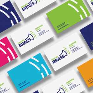 A series of colorful business cards for Denver Brass, featuring the name Jasmine Horn, contact details, and the organization's logo on a white, blue, green, pink, and orange background.