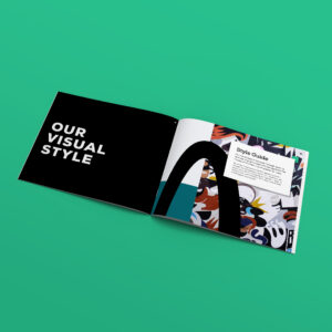 A style guide booklet is open to two pages: the left page reads “Our Visual Style,” and the right page contains a section titled “Style Guide” with colorful abstract designs in the background.