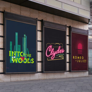 Three theater posters on a wall display: "Into the Woods," "Clydes," and "Romeo & Juliet," each with distinctive typography and design.