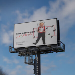 A billboard with a photo of a smiling child dressed in business attire, text reading "KEEP COLORADO CREATIVE," and additional scribbled doodles around the child.