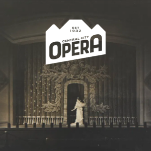 A performer in a white dress stands on a stage with decorative curtains. The Central City Opera logo is overlaid at the top center.